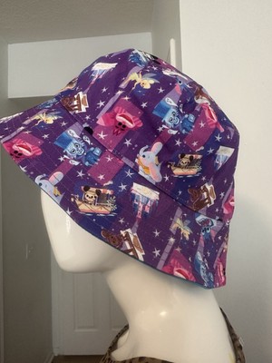 Hat themed with WALT DISNEY WORLD cartoons Mickey Dumbo Tinkerbell among others -image